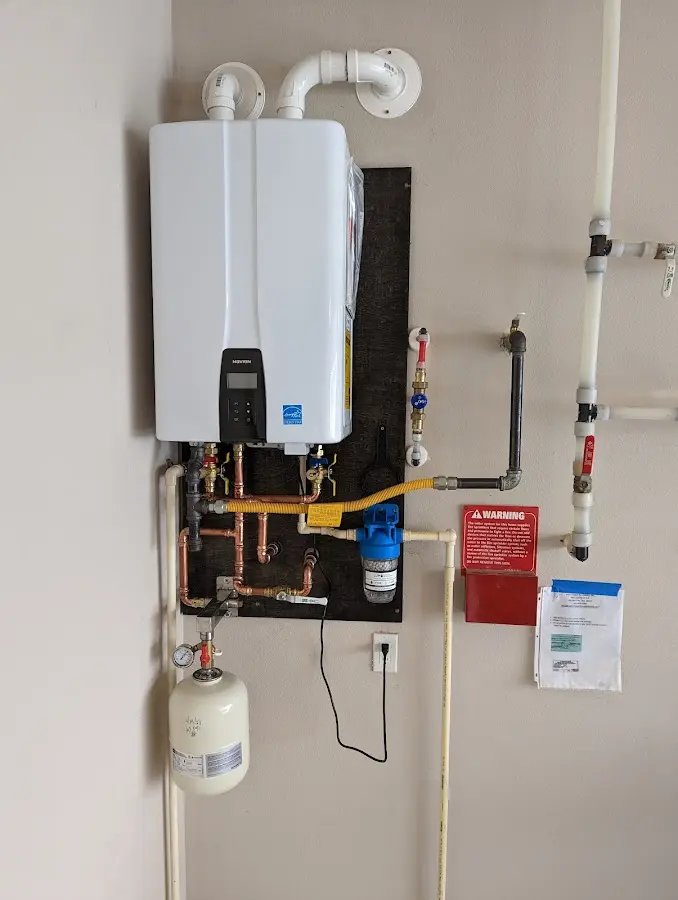 Professional plumber installing copper piping in a Homestead Meadows North home